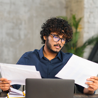 student / young person looking at paperwork