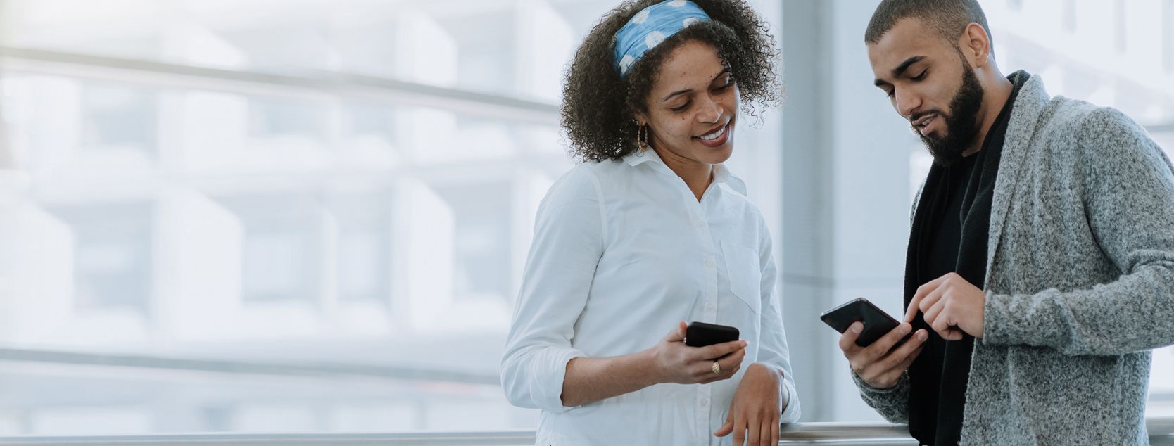 a couple smiles as they login to the Patelco mobile app