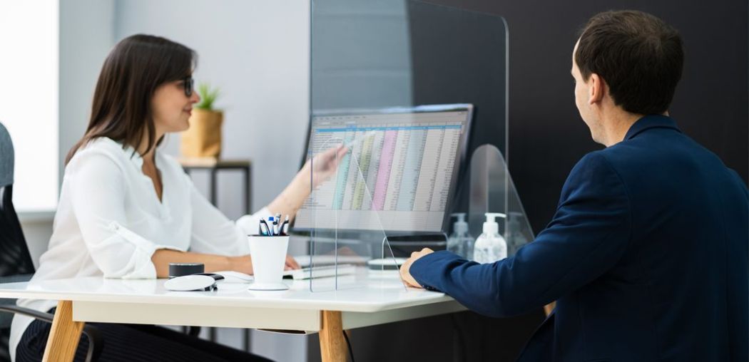 A Patelco employee reviews a savings account with a member.