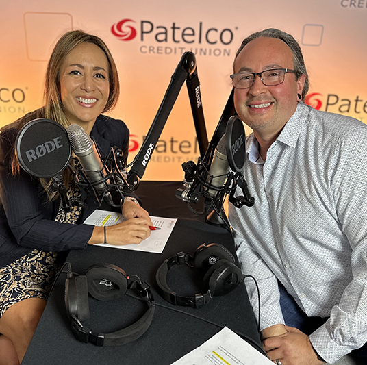 Patelco Employees Michele Enriquez and Joseph Luque at the podcast desk.