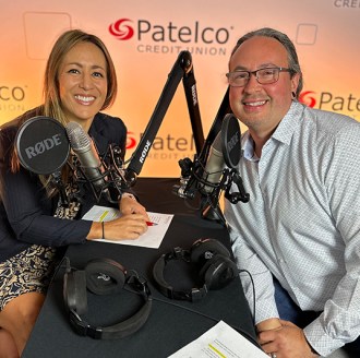 Patelco Employees Michele Enriquez and Joseph Luque at the podcast desk.