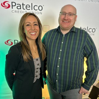 Patelco Employees Michele Enriquez and Charles Brandt at the podcast desk.