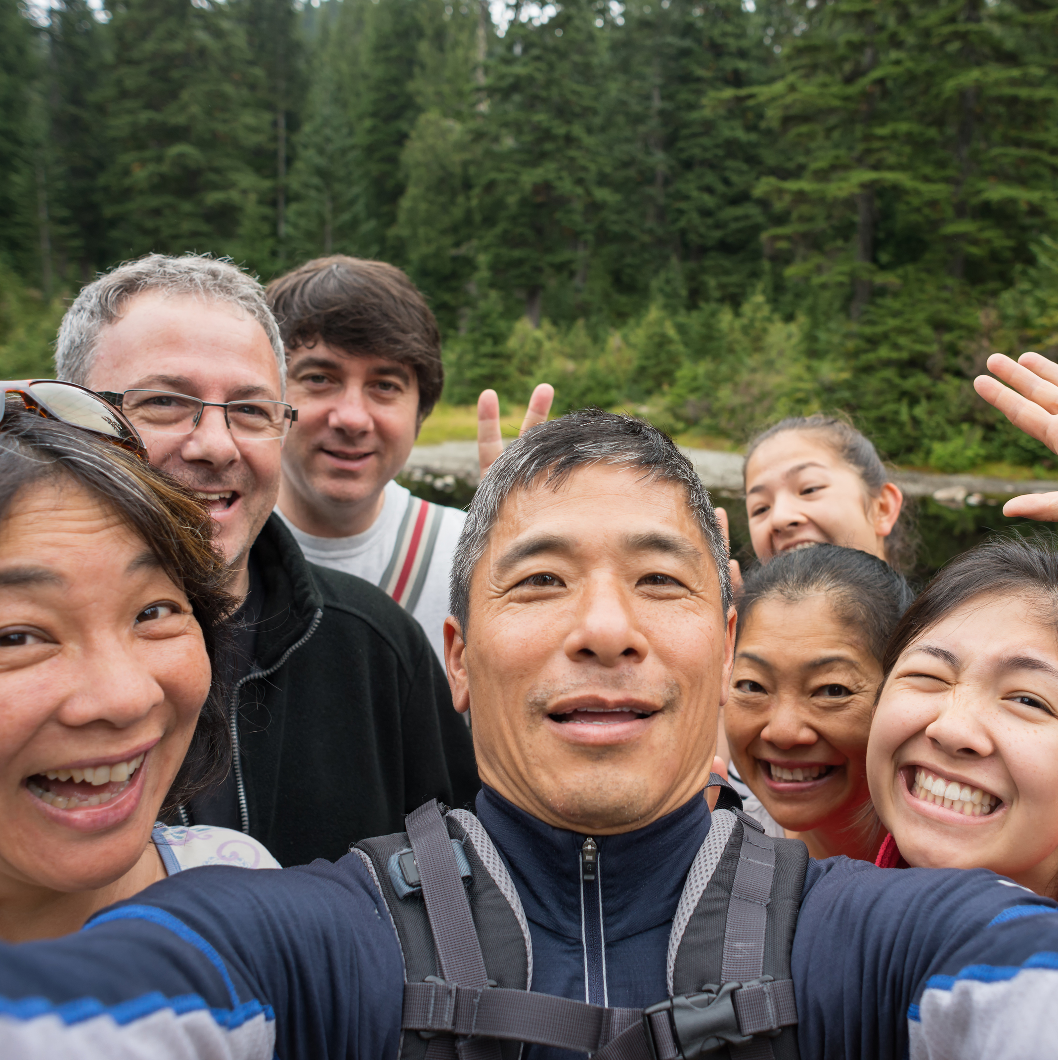 Two friends looking and smiling directly at the camera
